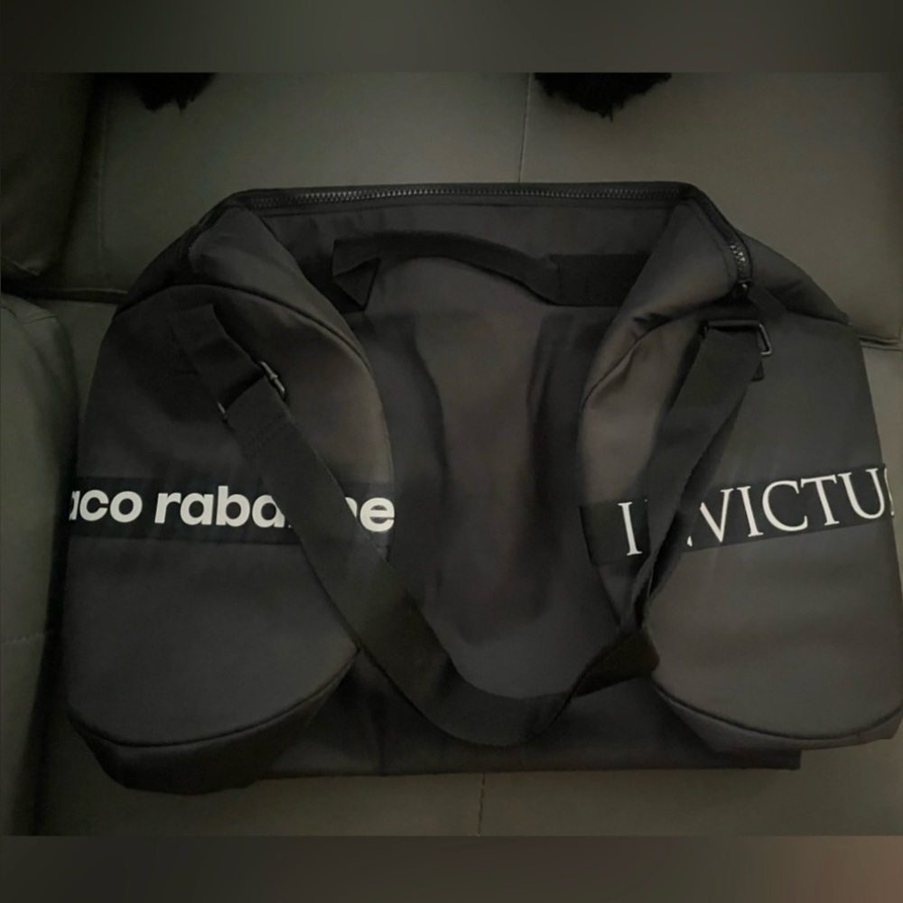 NEW! Limited Edition Paco Rabanne Bag. A waterproof comfortable bag in black.